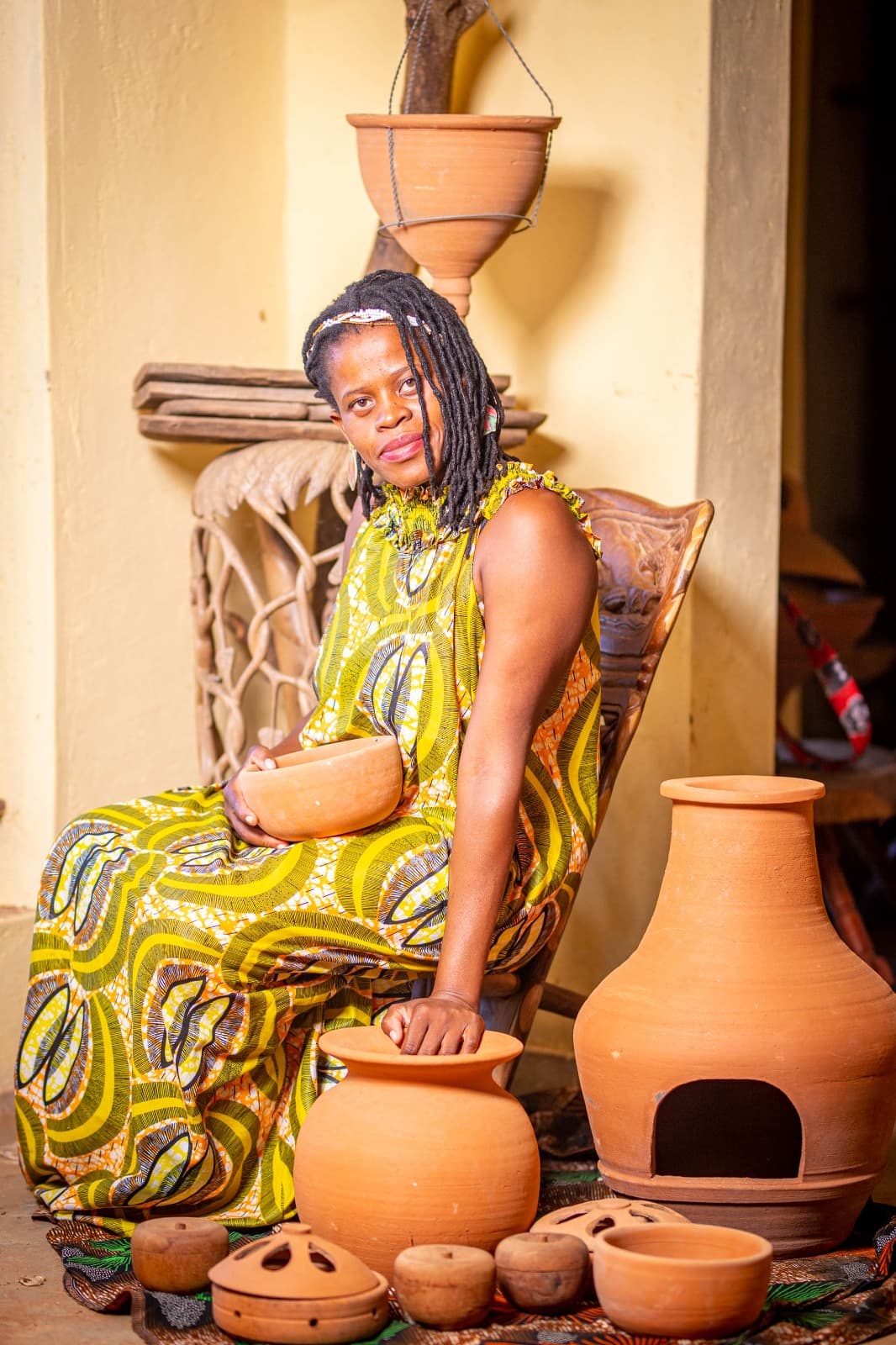 Artist with pottery collection
