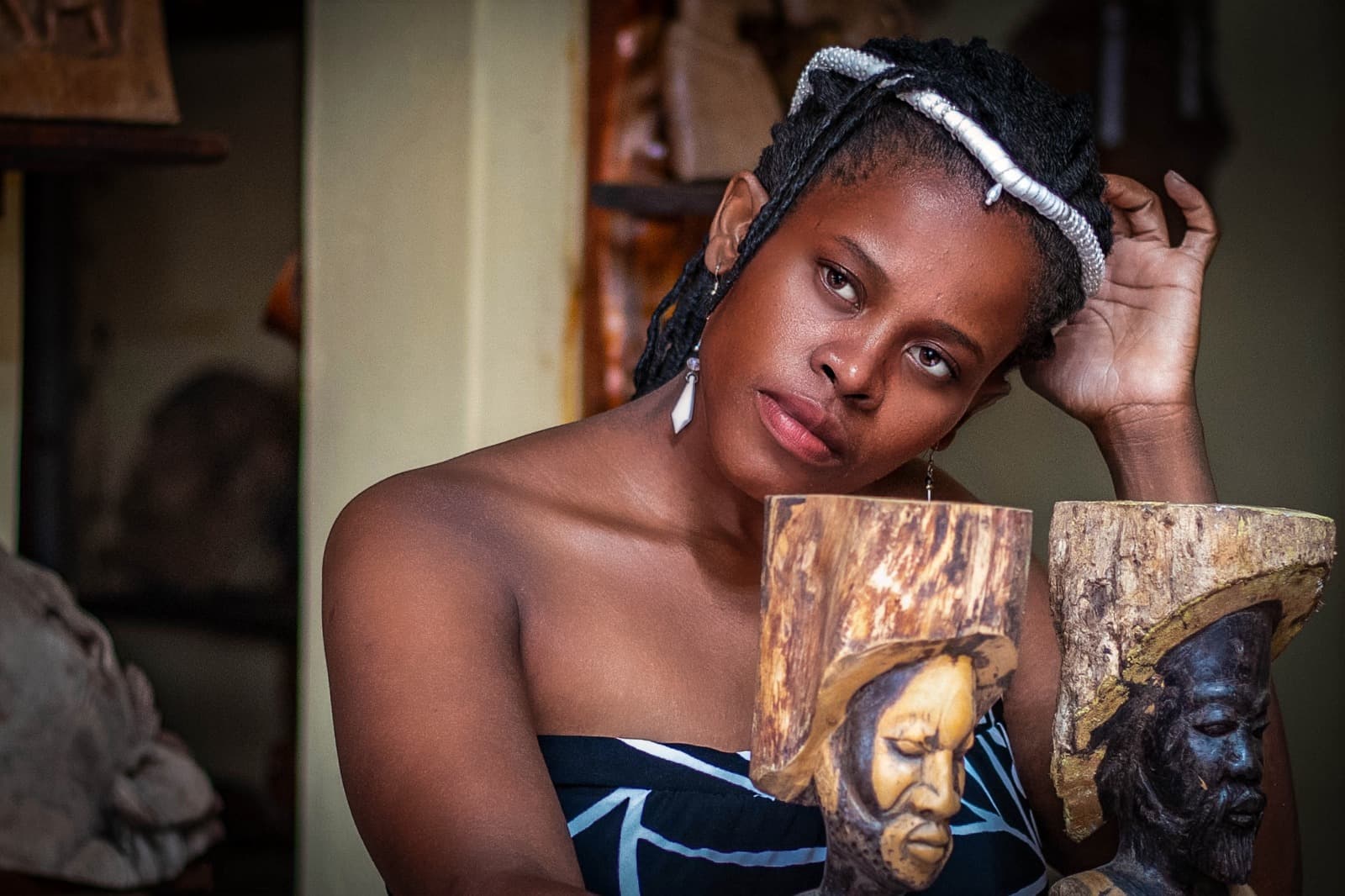 Artist with wooden sculptures
