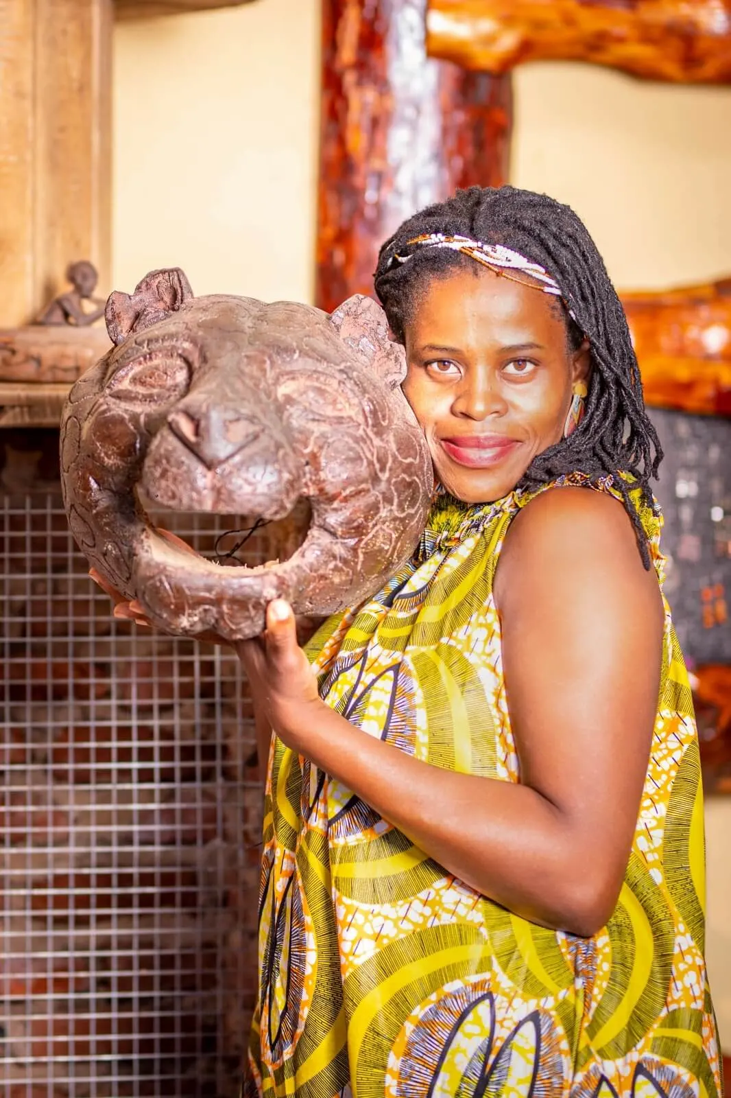 Thelmah Kutinyu standing thoughtfully in a doorway